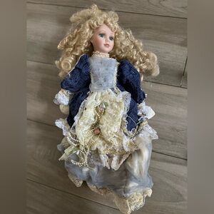 Elegant Porcelain Doll in Blue and Cream Dress